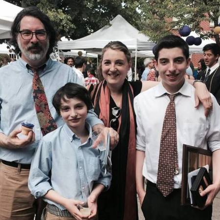 Eric Wolfhard with his wife and children.